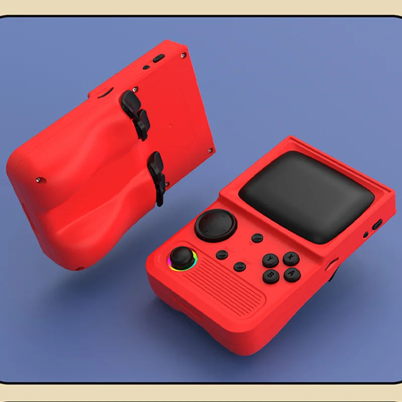 Red handheld gaming console with black screen and buttons on a blue surface